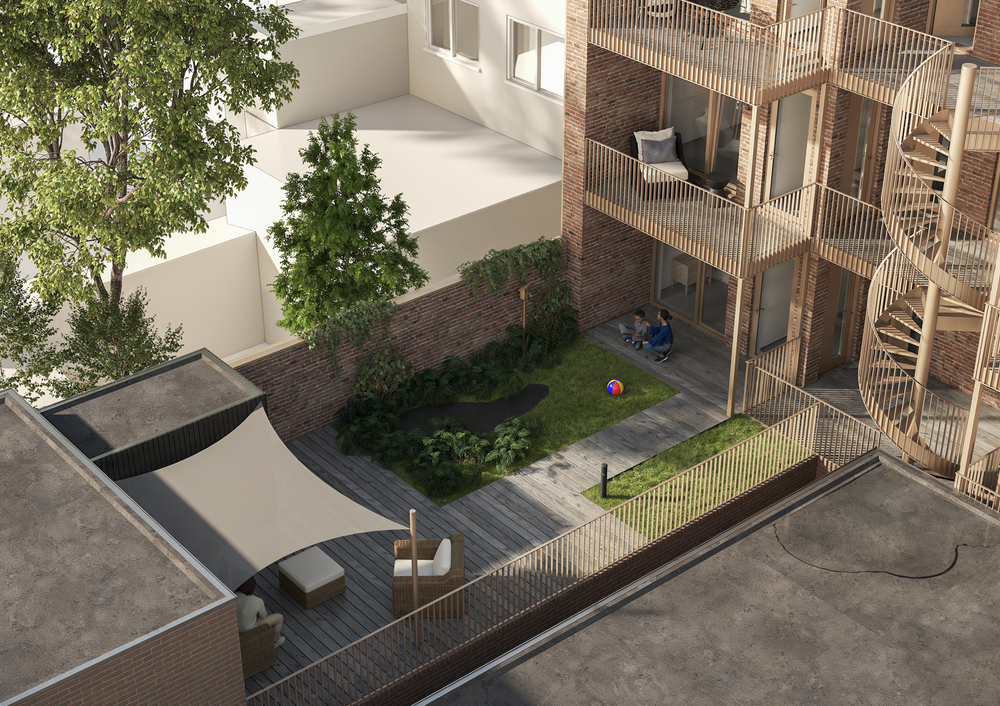 Vogelvluchtperspectief van de binnentuin met balkons en wenteltrap
